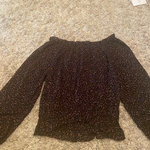 A black off the shoulder shirt